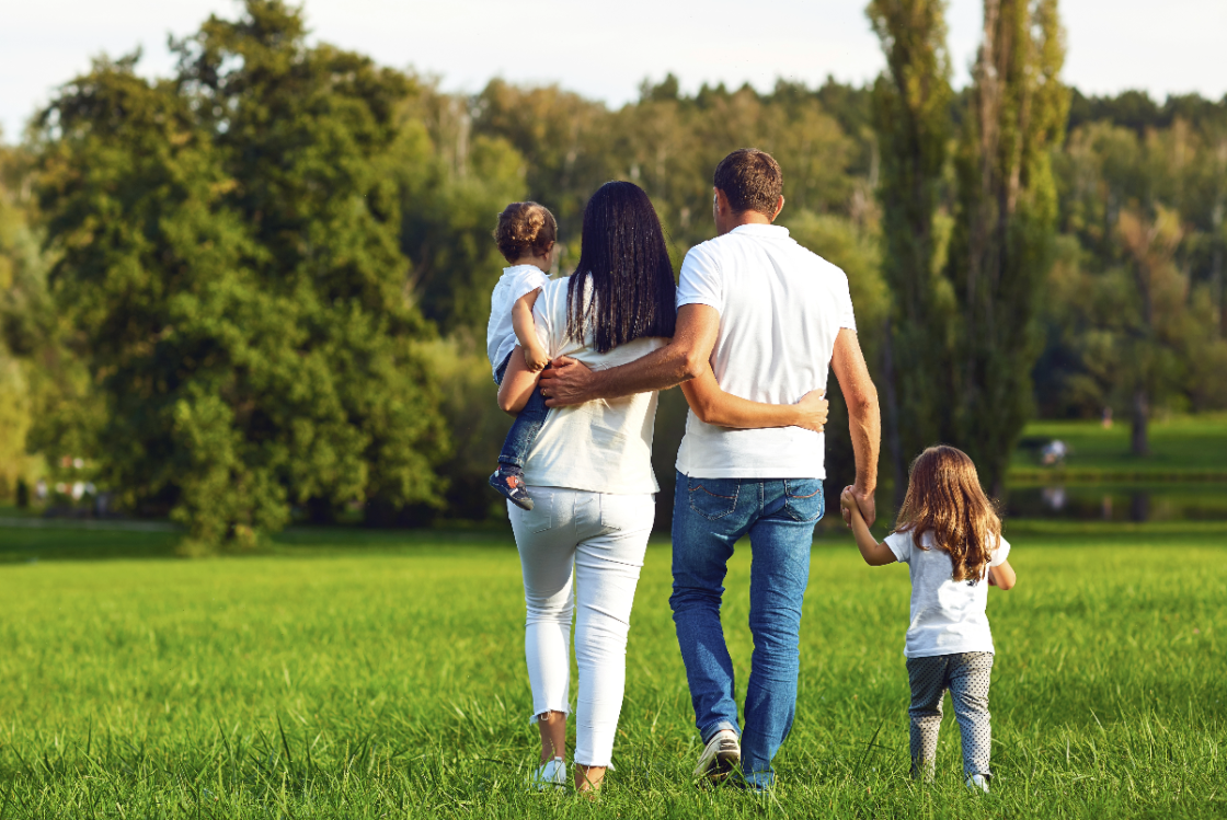 Family walking together in yard